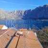 This newly built house with 143 sqm and an additional guesthouse (51 sqm) offers a prime location, just 330 meters from the coast, with an impressive panoramic view of the Bay of Kotor and the surrounding mountains.